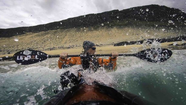Veiga Grétarsdóttir paddles his kayak through Icelandic breakers in AGAINST THE CURRENT